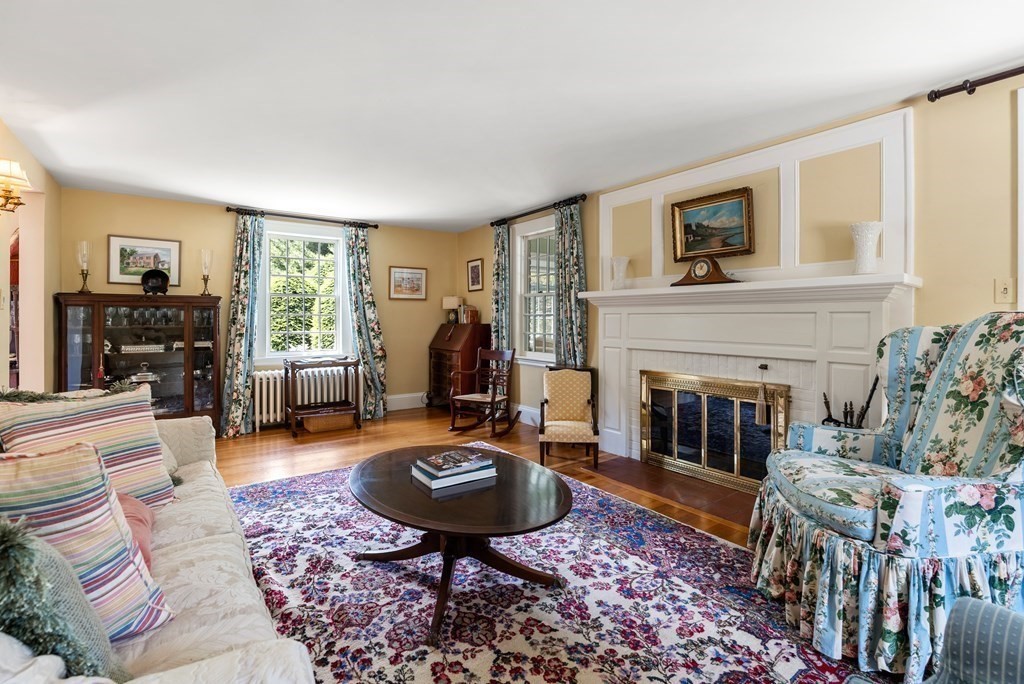 29 Sunset Road Weston, MA 02493 - Photo 14 of 29 a living room with furniture and a fireplace