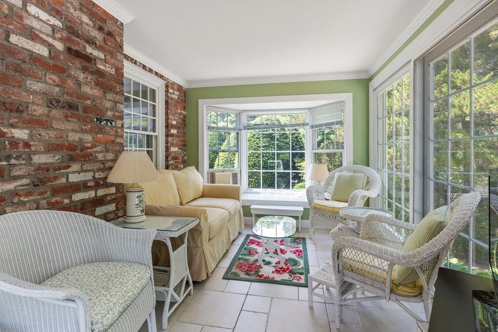 29 Sunset Road Weston, MA 02493 - Photo 15 of 29 a living room with furniture and a floor to ceiling window