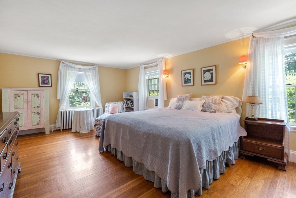 29 Sunset Road Weston, MA 02493 - Photo 19 of 29 a bedroom with a bed a mirror and a window