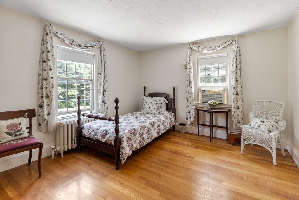 29 Sunset Road Weston, MA 02493 - Photo 20 of 29 a bedroom with a bed chair and window