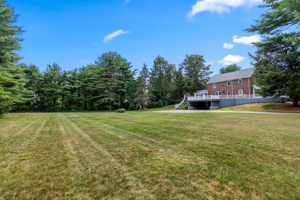 29 Sunset Road Weston, MA 02493 - Photo 29 of 29 a view of a house with a yard