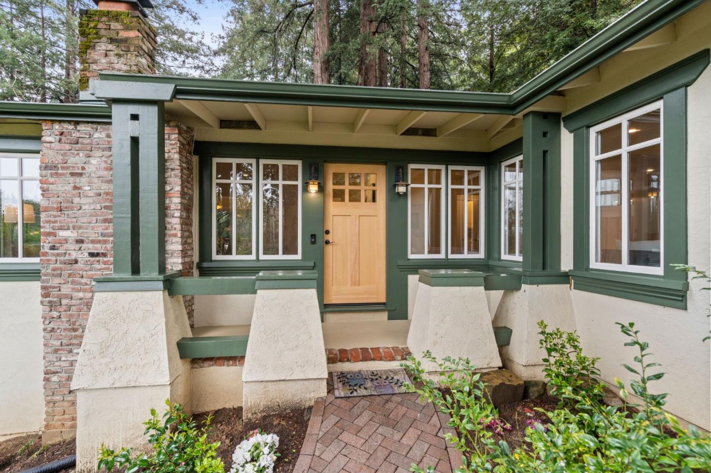 555 Summit Spring Road Woodside, CA 94062 - Photo 1 of 90 a front view of a house with a garden