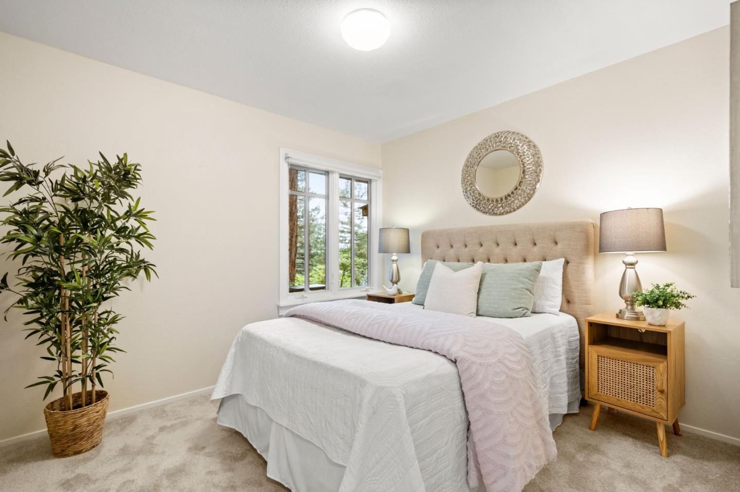 555 Summit Spring Road Woodside, CA 94062 - Photo 31 of 90 a bedroom with a bed and a potted plant
