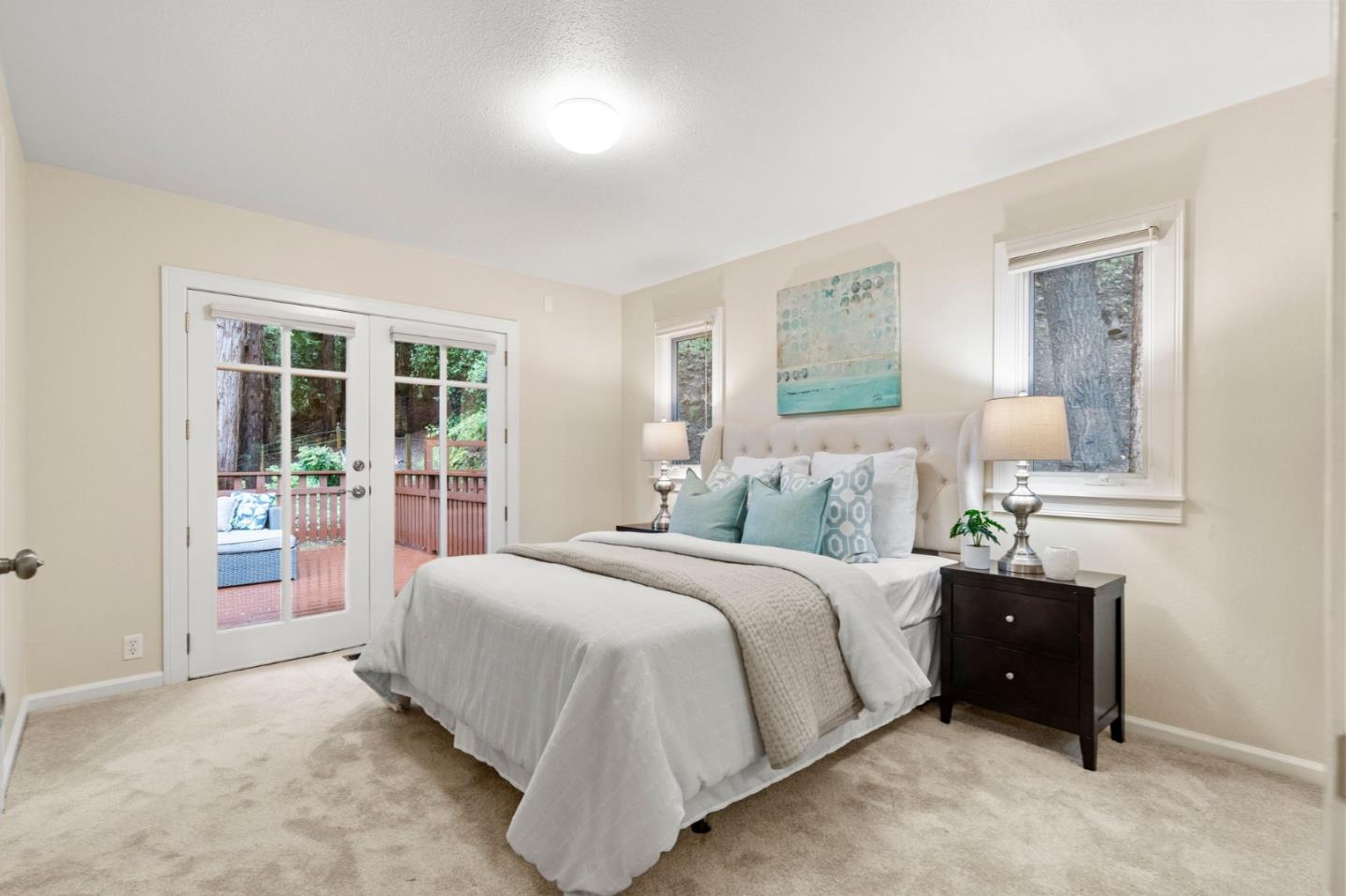 555 Summit Spring Road Woodside, CA 94062 - Photo 34 of 90 a spacious bedroom with a bed and a window