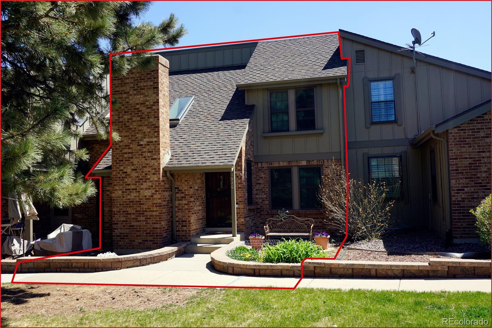 7920 East Phillips Circle Centennial, CO 80112 - Photo 12 of 13 a front view of a house with garden