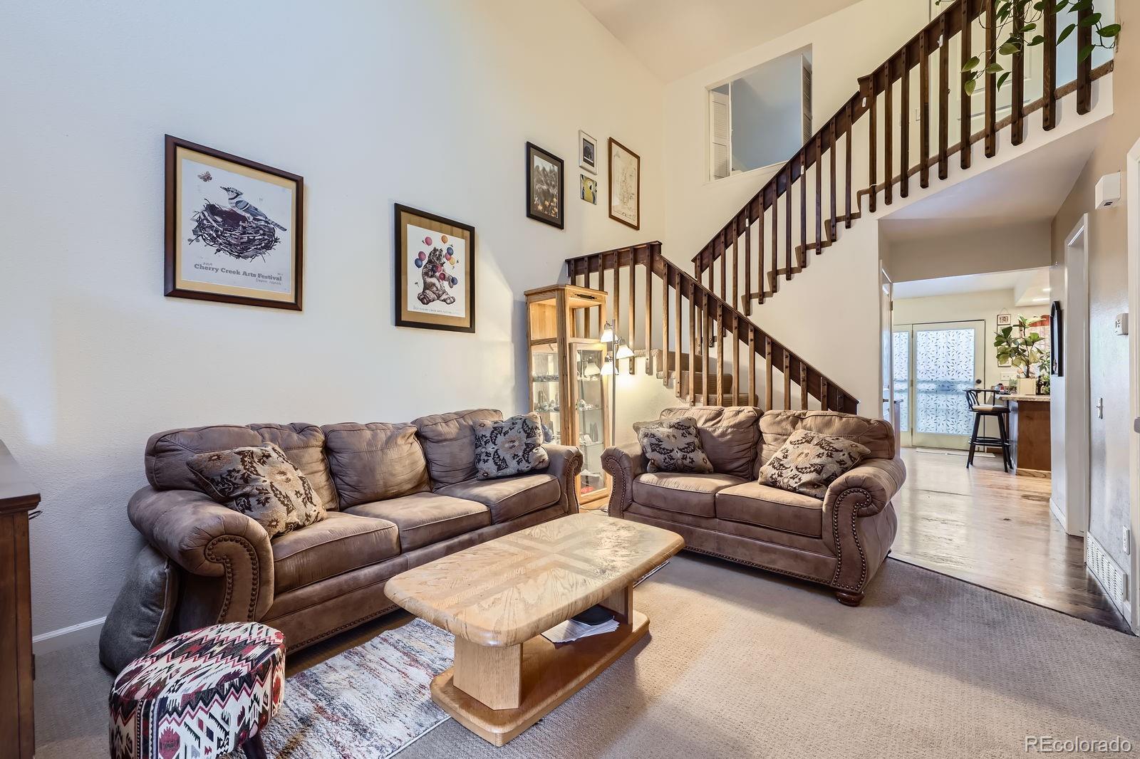 7920 East Phillips Circle Centennial, CO 80112 - Photo 2 of 13 a living room with furniture and a couches