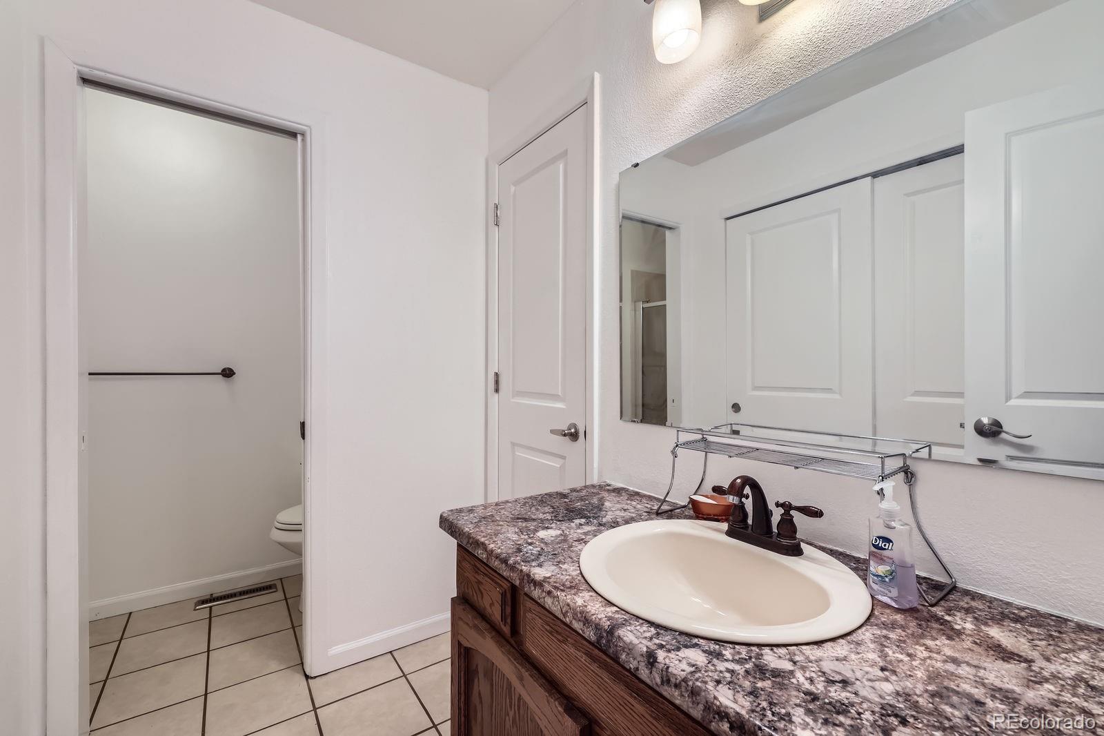 7920 East Phillips Circle Centennial, CO 80112 - Photo 6 of 13 a bathroom with a sink and a mirror