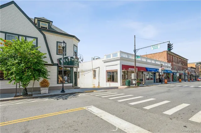 a view of street with small buildings