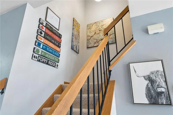a room with wooden floor and stairs