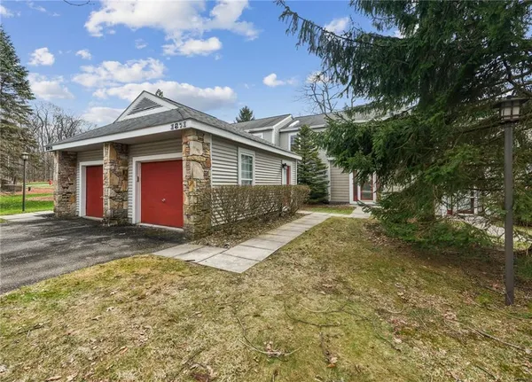 a view of a house with a yard