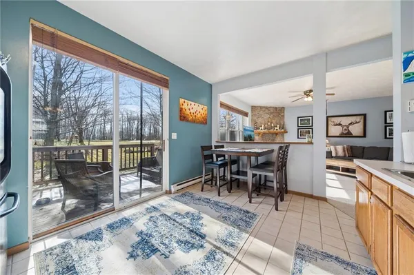 a view of a dining room with furniture window and outside view