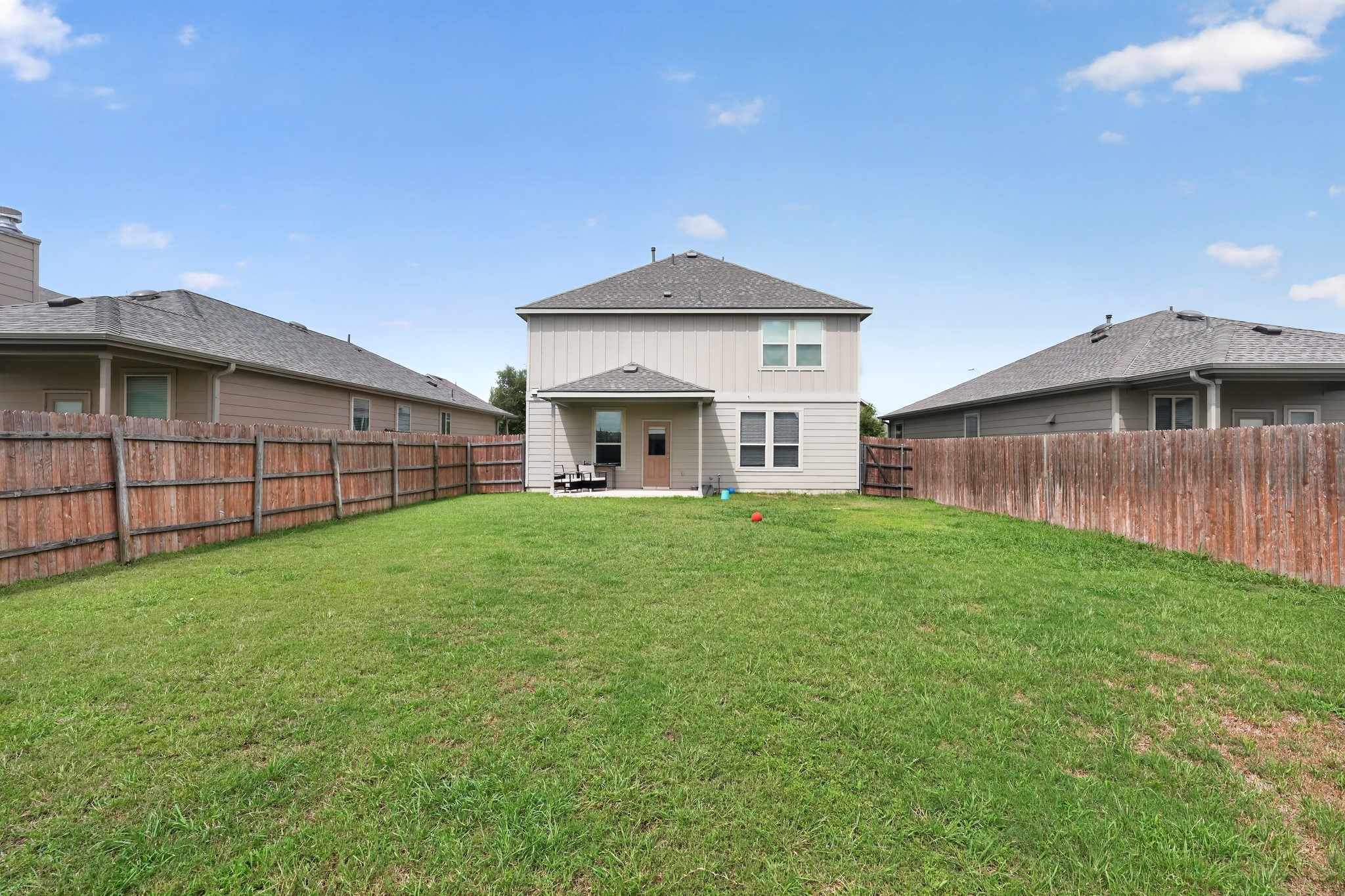 521 Staton Street Georgetown, TX 78626 - Photo 34 of 39 a view of a house with a yard