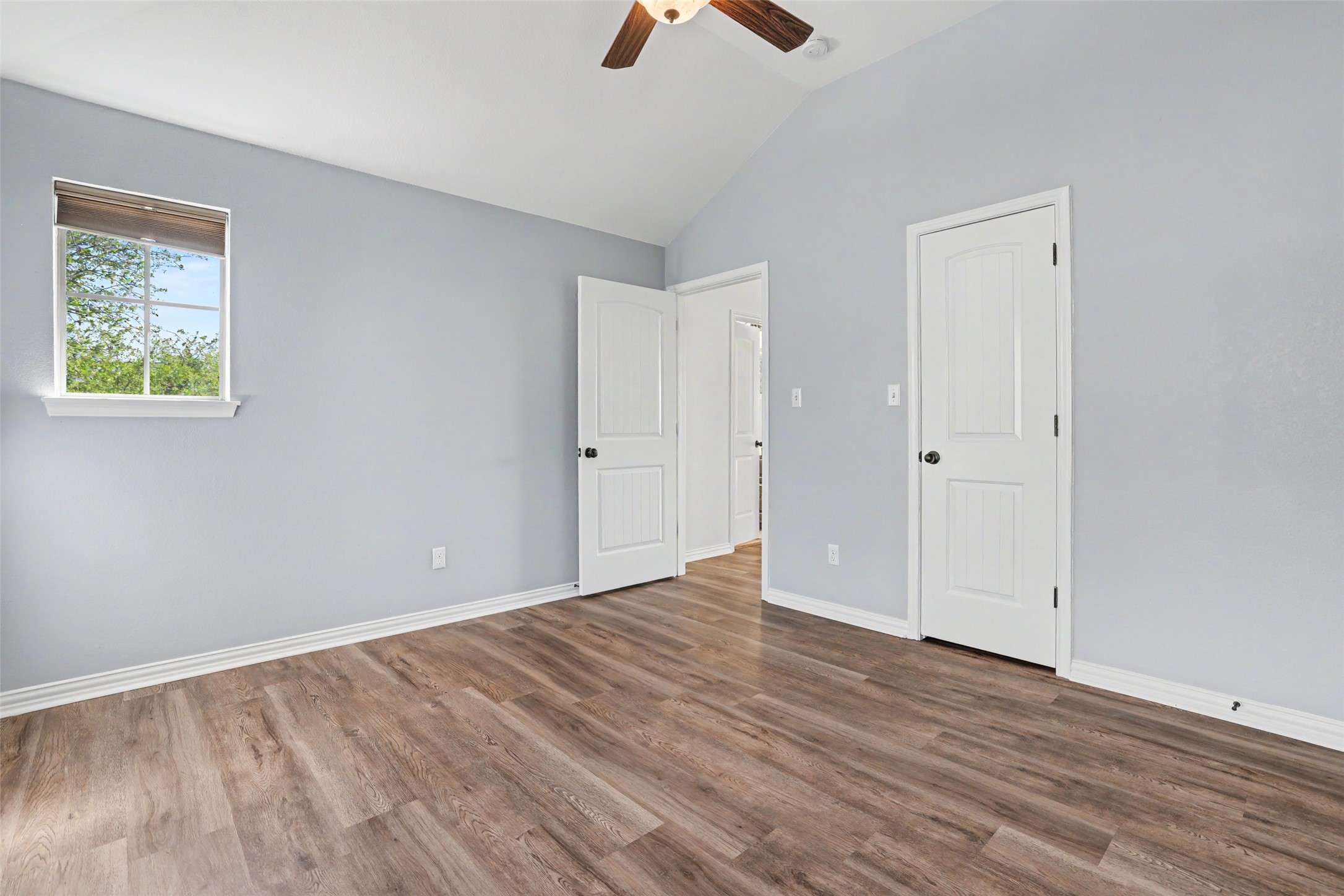 1020 Winding Way Drive Georgetown, TX 78628 - Photo 21 of 32 Unfurnished bedroom with lofted ceiling, dark wood-type flooring, and a ceiling fan