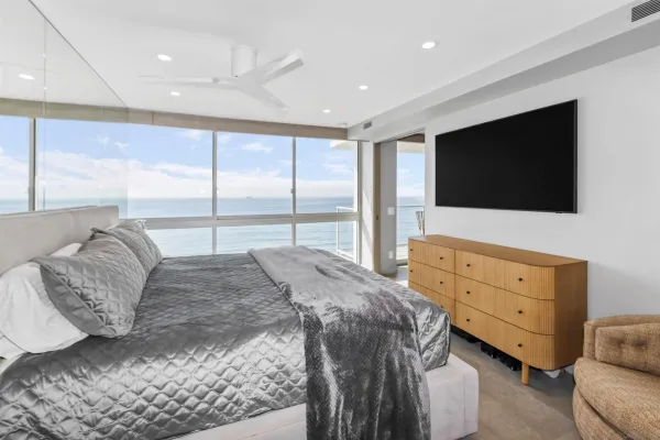 a bed room with a bed and a large window