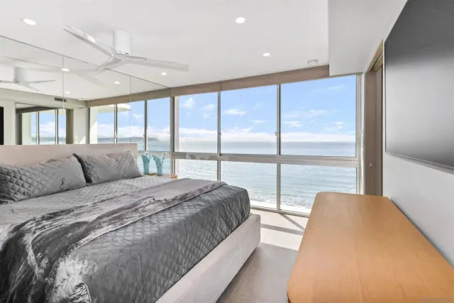 a bathroom with a double vanity sink mirror and shower