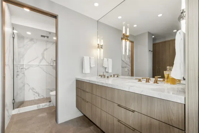 a bathroom with a toilet and shower