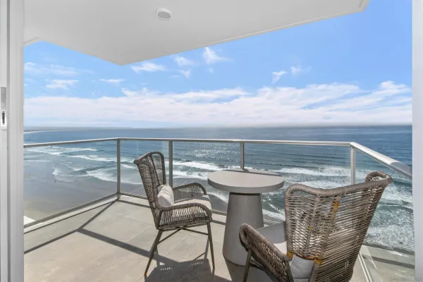 a view of swimming pool outdoor seating and city view
