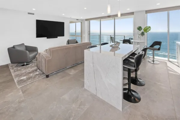 a view of a livingroom with furniture and a flat screen tv