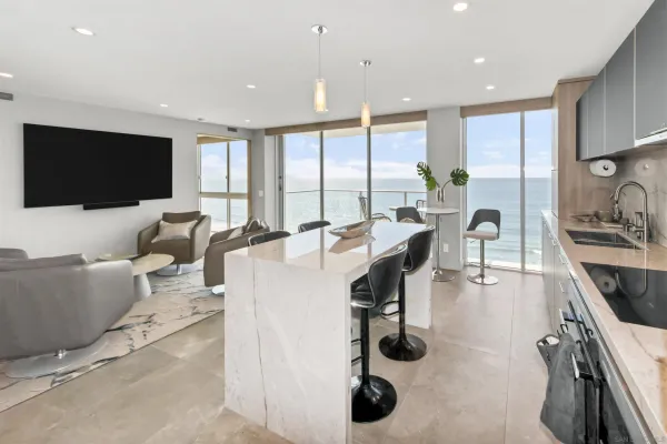 a living room with furniture a flat screen tv and a large window