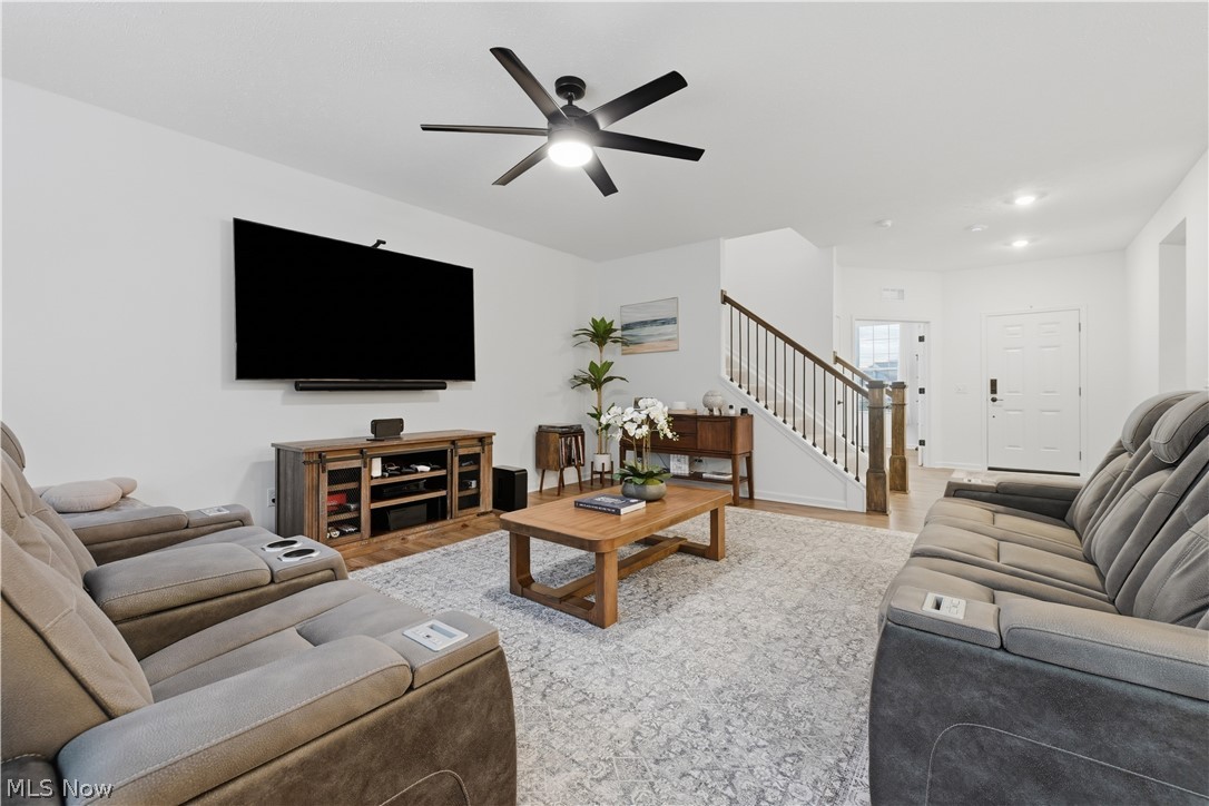 3785 Rachael Lane Uniontown, OH 44685 - Photo 6 of 49 Lovely, spacious living room with a celing fan with light and LVT flooring