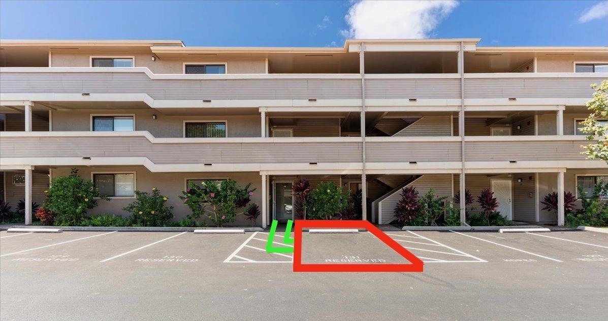 2747 South Kihei Road, Unit E104 Kihei, HI 96753 - Photo 13 of 49 a view of a building with a yard