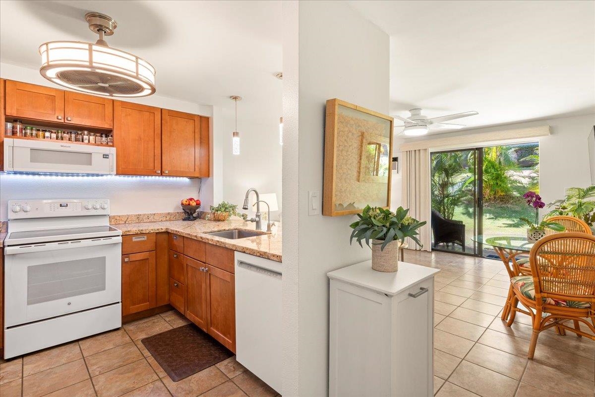 2747 South Kihei Road, Unit E104 Kihei, HI 96753 - Photo 16 of 49 a kitchen with a sink and cabinets
