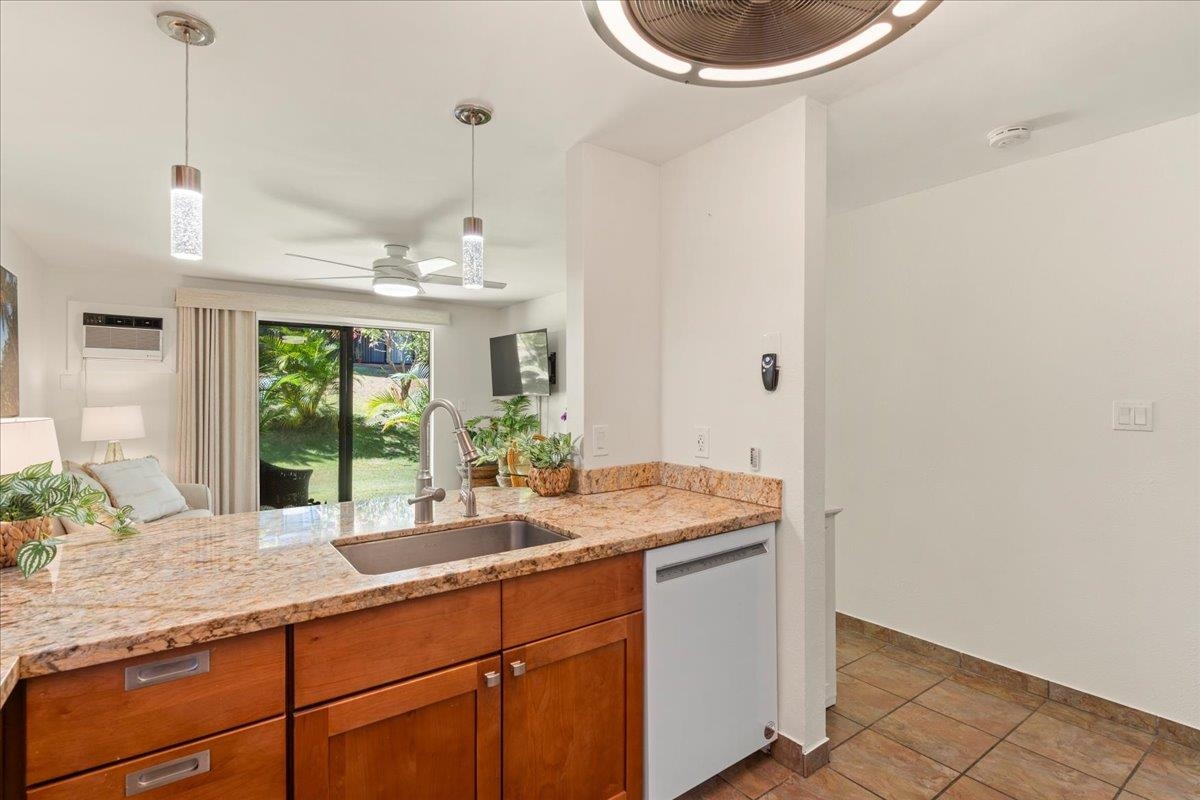 2747 South Kihei Road, Unit E104 Kihei, HI 96753 - Photo 17 of 49 a bathroom with a granite countertop sink and a mirror