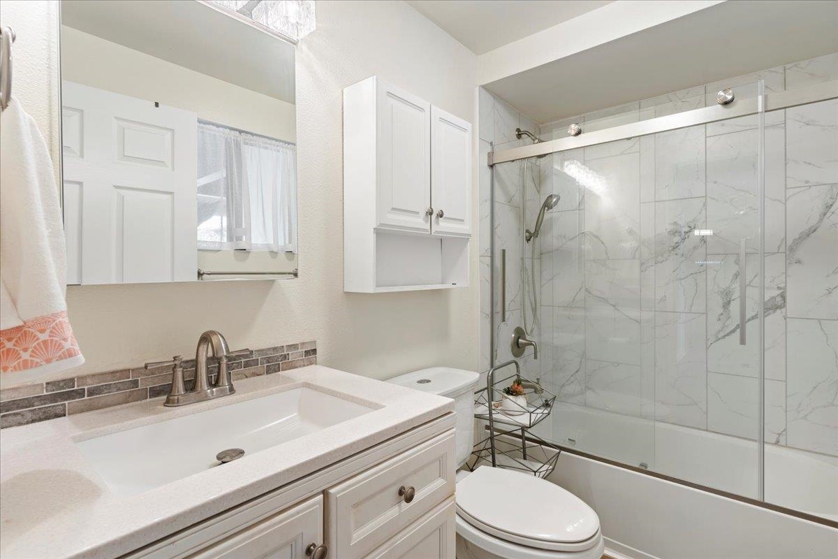 2747 South Kihei Road, Unit E104 Kihei, HI 96753 - Photo 2 of 49 a bathroom with a sink toilet a mirror and shower