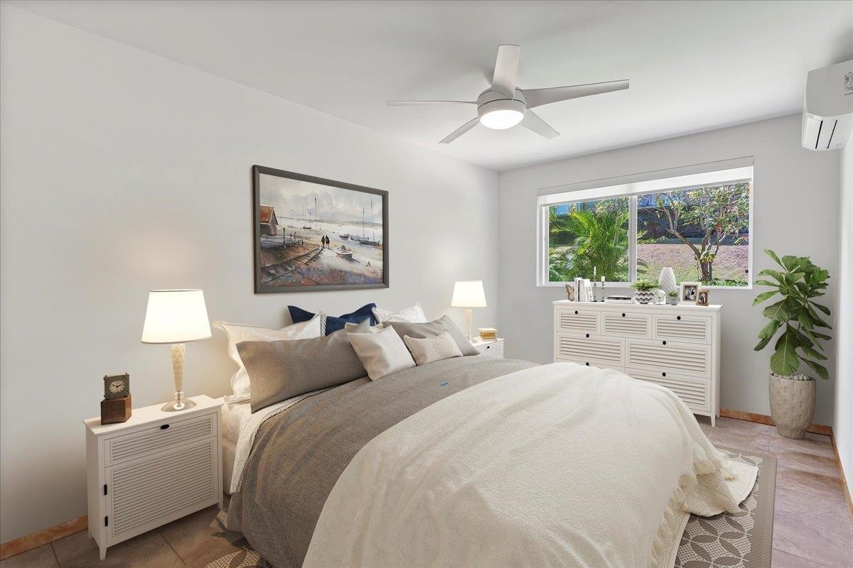 2747 South Kihei Road, Unit E104 Kihei, HI 96753 - Photo 32 of 49 a bedroom with a large bed and a large window