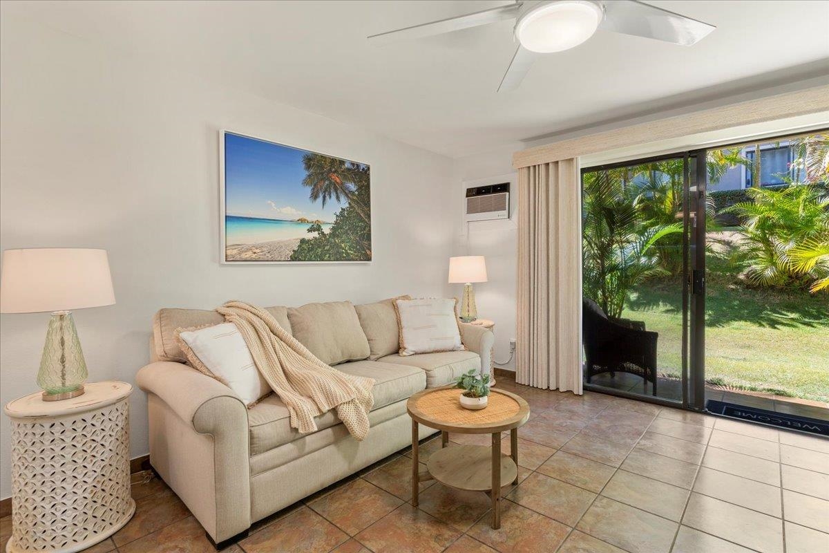 2747 South Kihei Road, Unit E104 Kihei, HI 96753 - Photo 36 of 49 a living room with furniture and a large window