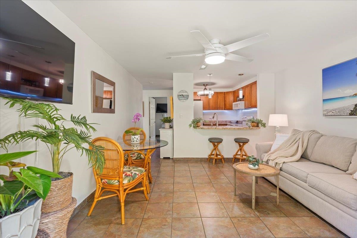 2747 South Kihei Road, Unit E104 Kihei, HI 96753 - Photo 6 of 49 a living room with furniture and a flat screen tv