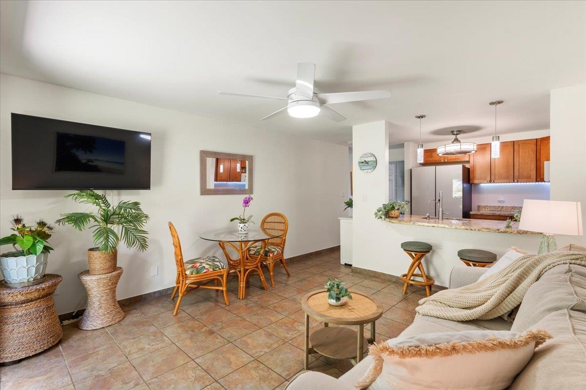 2747 South Kihei Road, Unit E104 Kihei, HI 96753 - Photo 8 of 49 a living room with furniture potted plant and a window