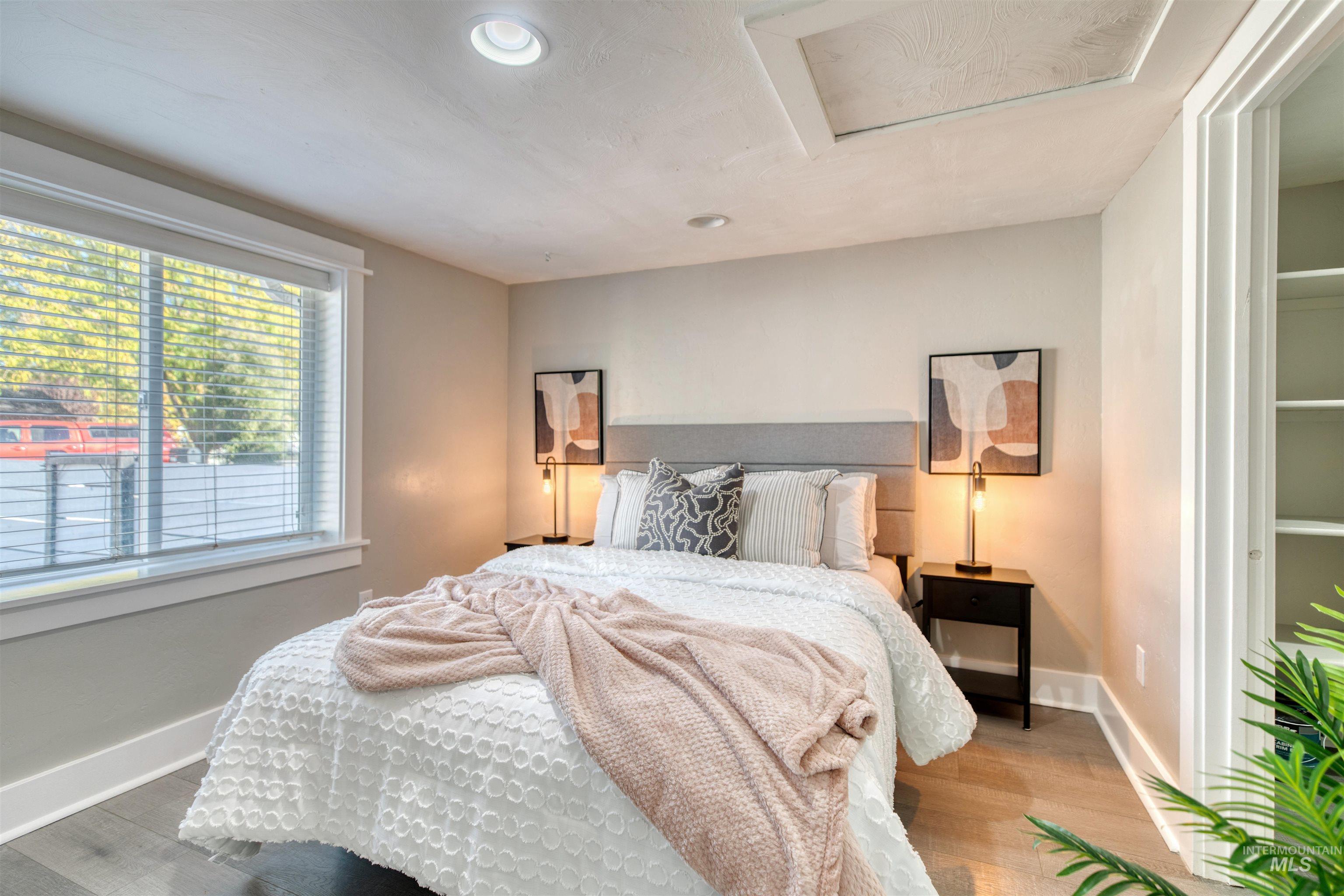 3311 West Hamilton Street Boise, ID 83705 - Photo 12 of 32 Bedroom with attic access, recessed lighting, and wood finished floors