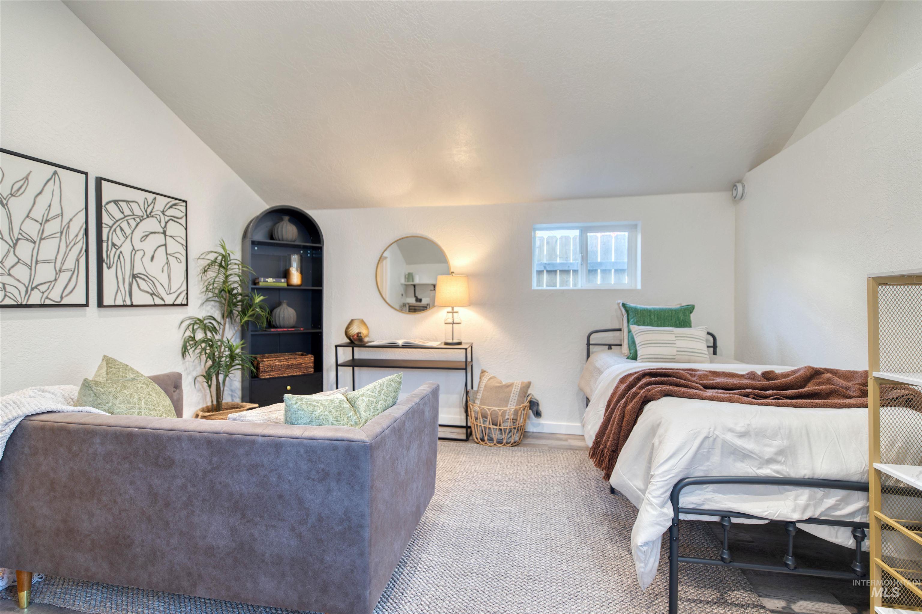 3311 West Hamilton Street Boise, ID 83705 - Photo 25 of 32 Bedroom with lofted ceiling and baseboards