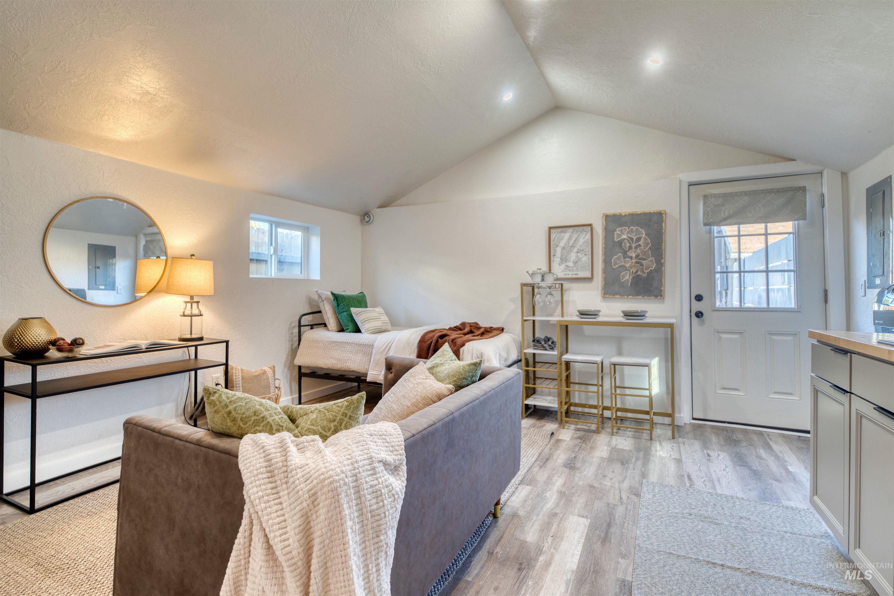 3311 West Hamilton Street Boise, ID 83705 - Photo 29 of 32 Living room with lofted ceiling and light wood-style floors
