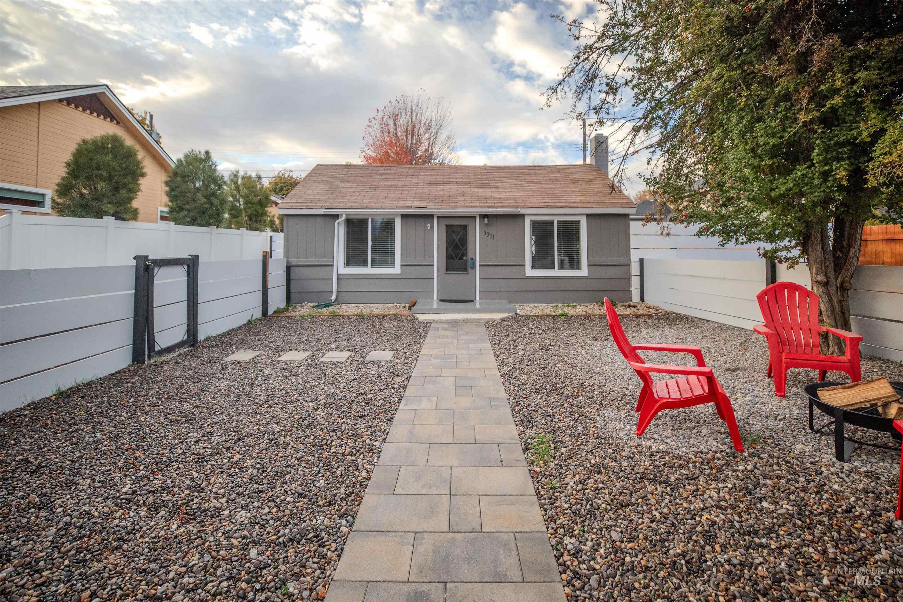 3311 West Hamilton Street Boise, ID 83705 - Photo 5 of 32 View of front of house with a fenced yard and a shingled roof