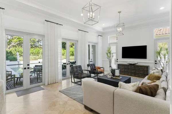 a view of a hallway with wooden floor and cabinet