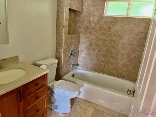 14153 Powers Road Poway, CA 92064 - Photo 10 of 12 a bathroom with a sink a toilet and shower