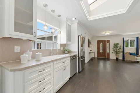 a kitchen with a sink and cabinets