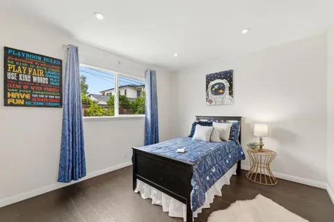 a bed room with a bed and a window