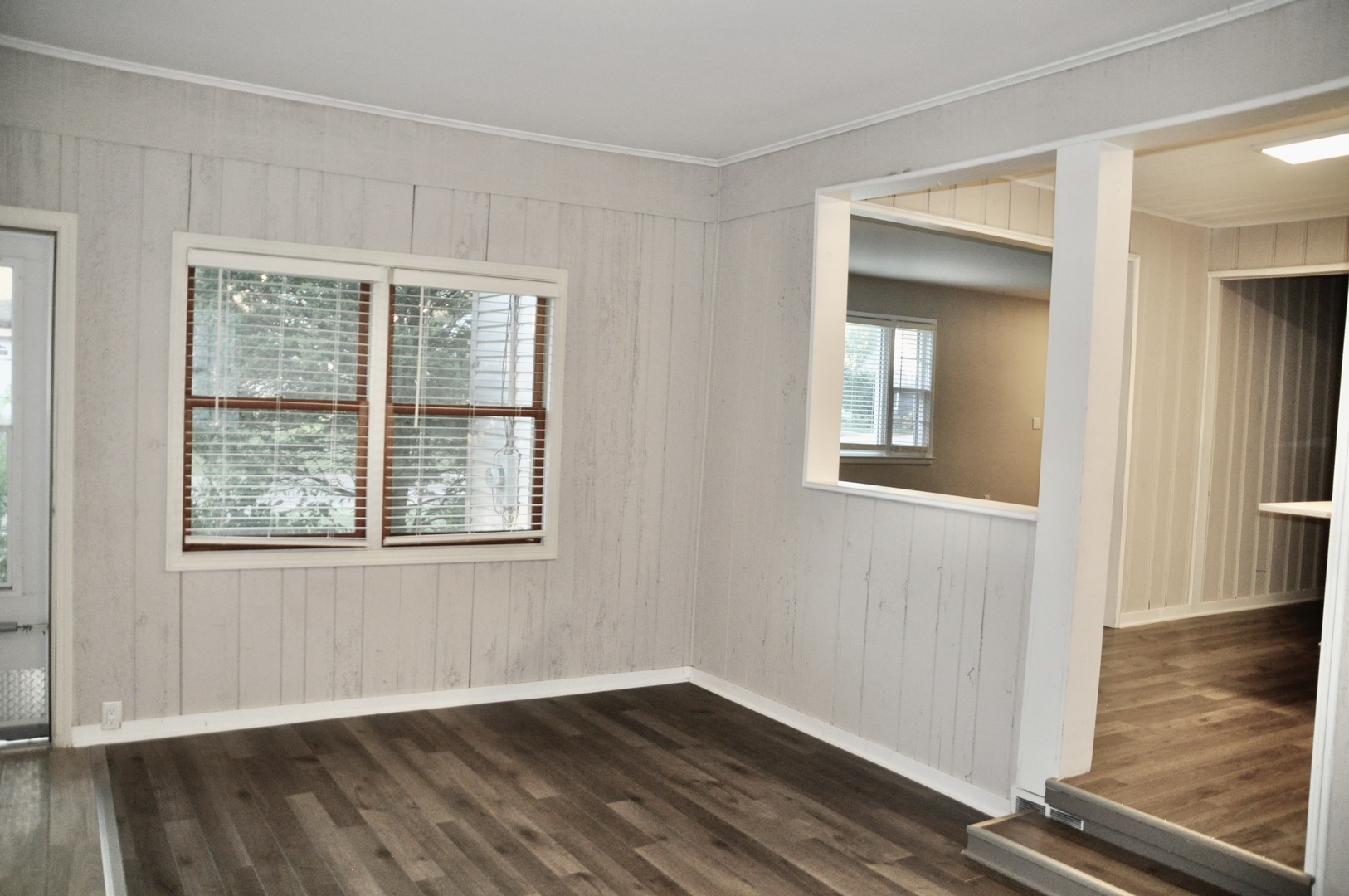 110 West 12th Avenue Naperville, IL 60563 - Photo 12 of 21 an empty room with wooden floor and windows