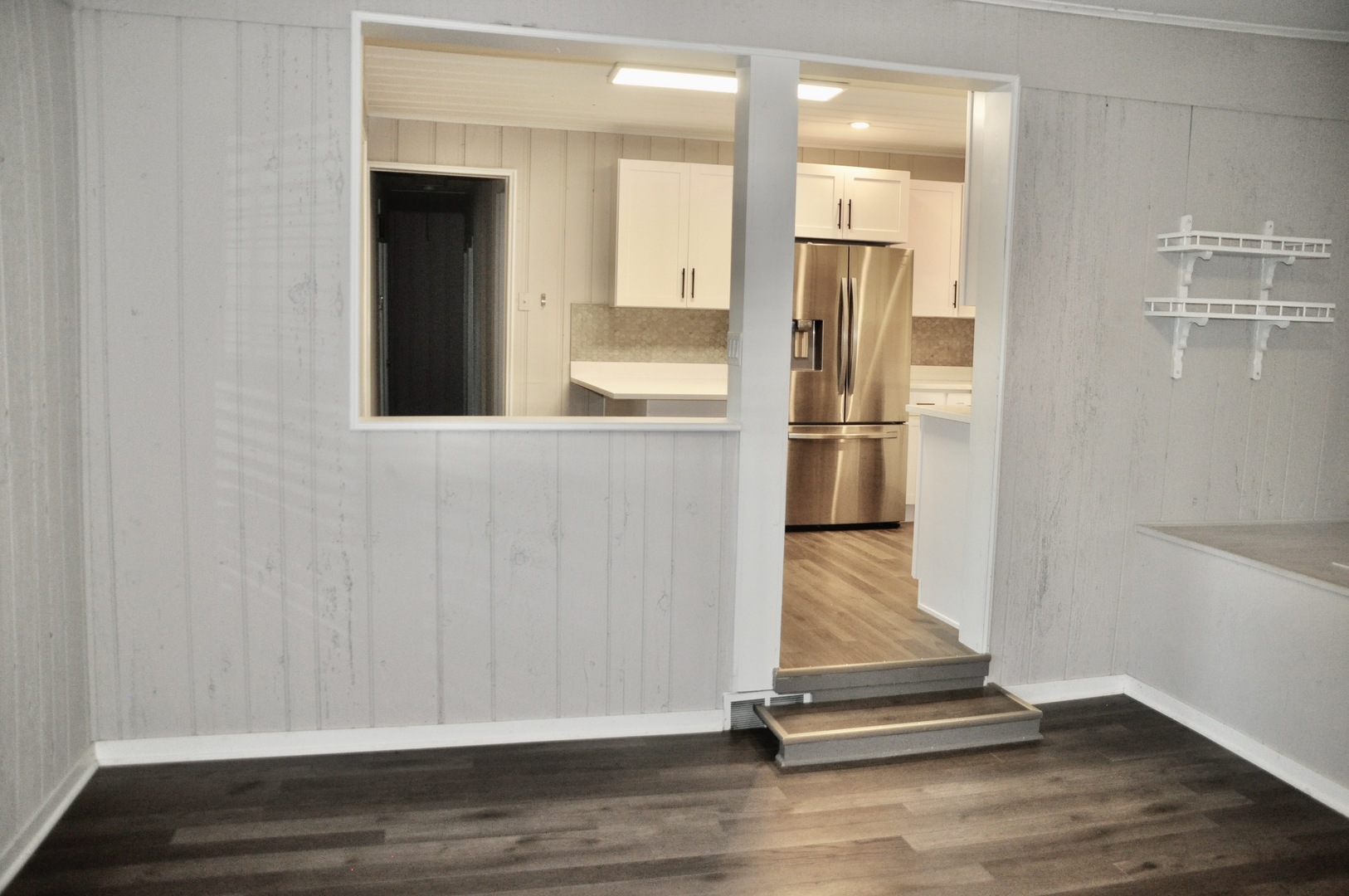 110 West 12th Avenue Naperville, IL 60563 - Photo 10 of 21 a room view with wooden floor and walls