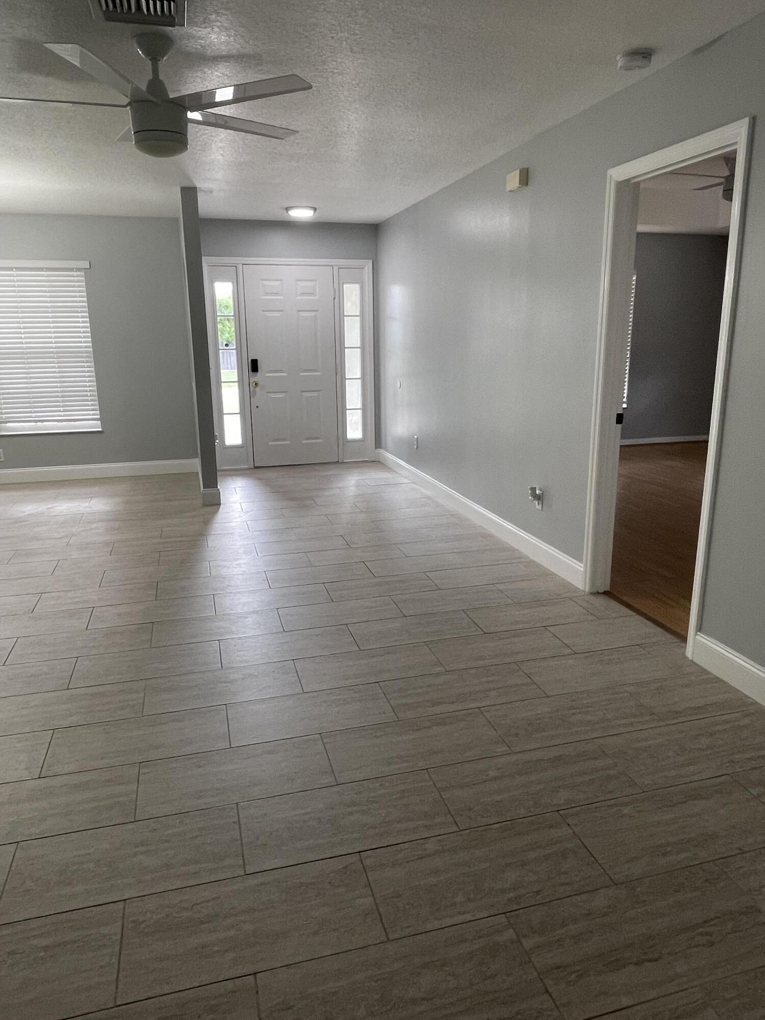 145 Southwest Hawthorne Circle Port St. Lucie, FL 34953 - Photo 13 of 37 a view of an empty room