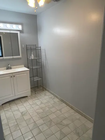 a bathroom with a sink a toilet and mirror