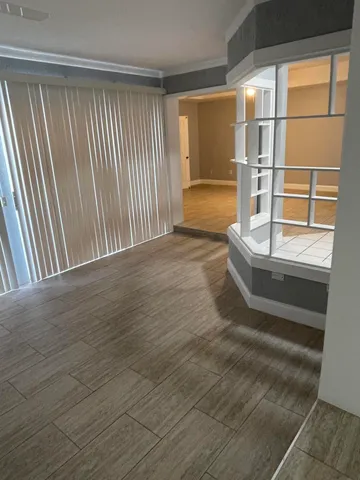 a view of a house with a swimming pool and a yard