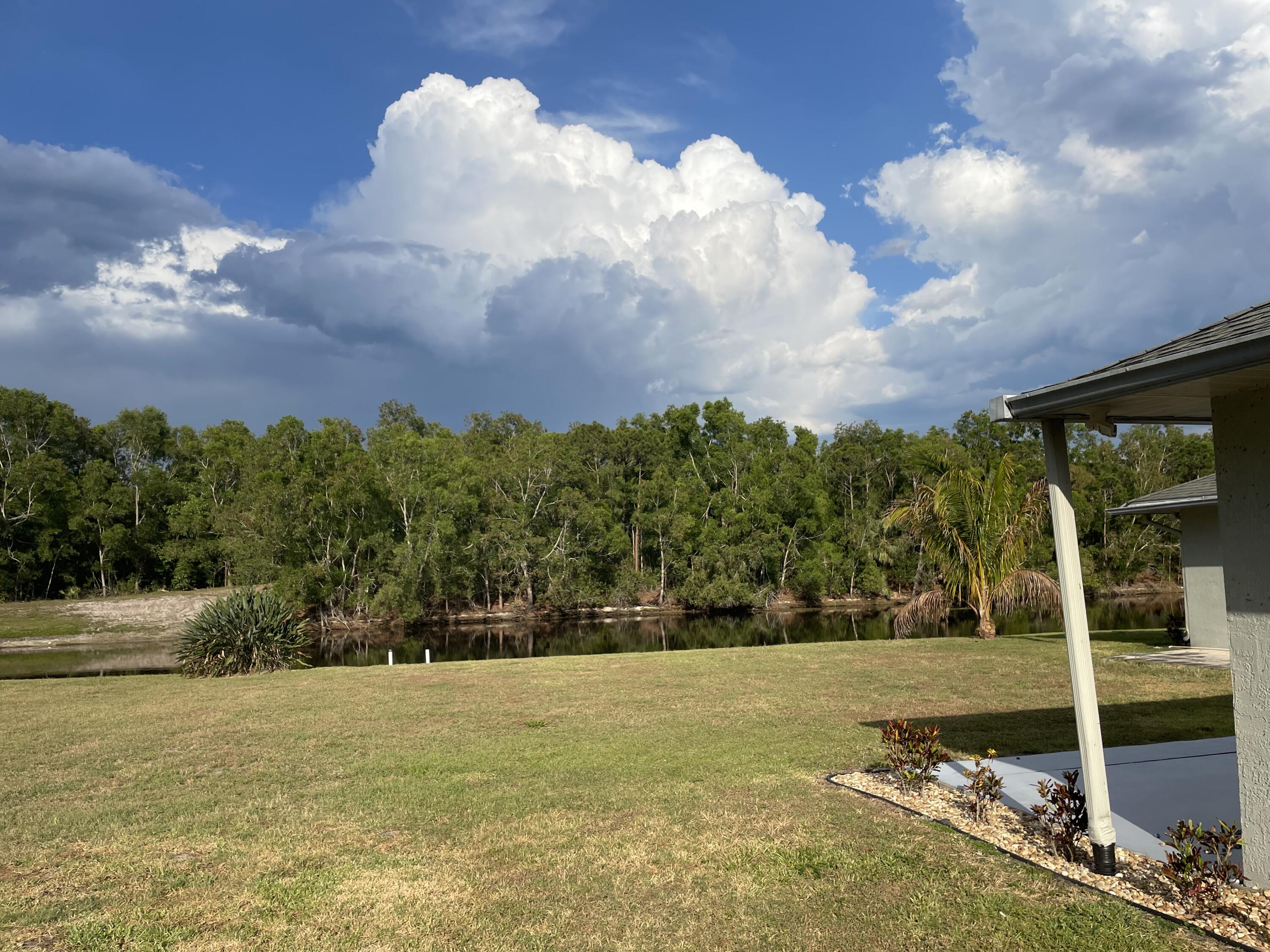 145 Southwest Hawthorne Circle Port St. Lucie, FL 34953 - Photo 35 of 37 a view of a yard