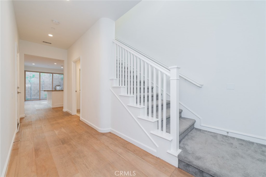 103 Tidal Irvine, CA 92620 - Photo 2 of 25 a view of a hallway with wooden floor and entryway