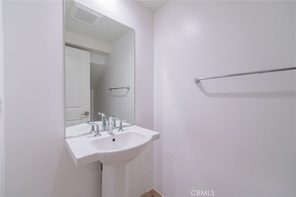103 Tidal Irvine, CA 92620 - Photo 3 of 25 a bathroom with a sink and a mirror
