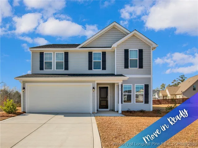 a front view of a house with yard