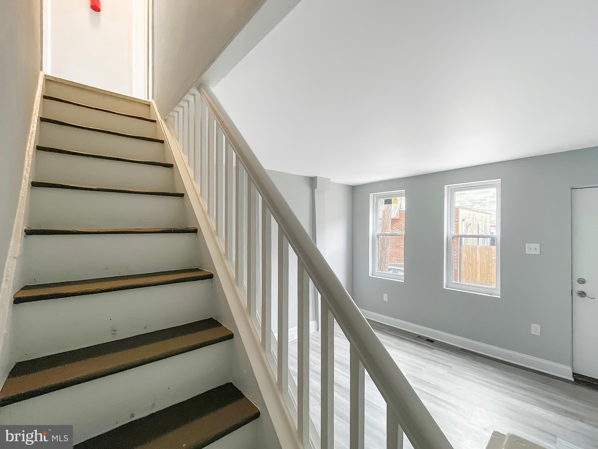 160 McClellan Street Philadelphia, PA 19148 - Photo 11 of 29 a view of staircase with wooden floor and white walls